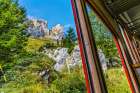 Colorful cogwheel rail car climbing Mount Pilatus-Lucerne-Switzerland. Art Print